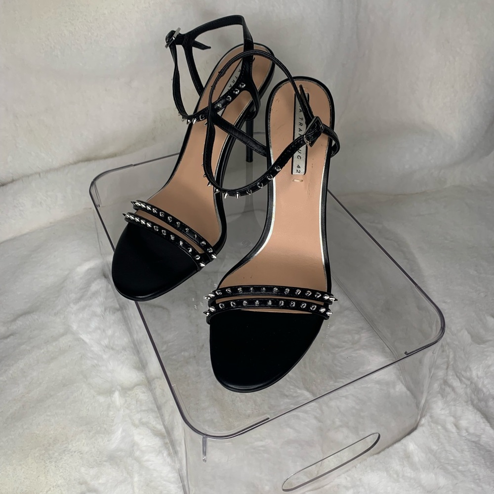 Brand new Zara heels black with spikes around the ankles and toe band.